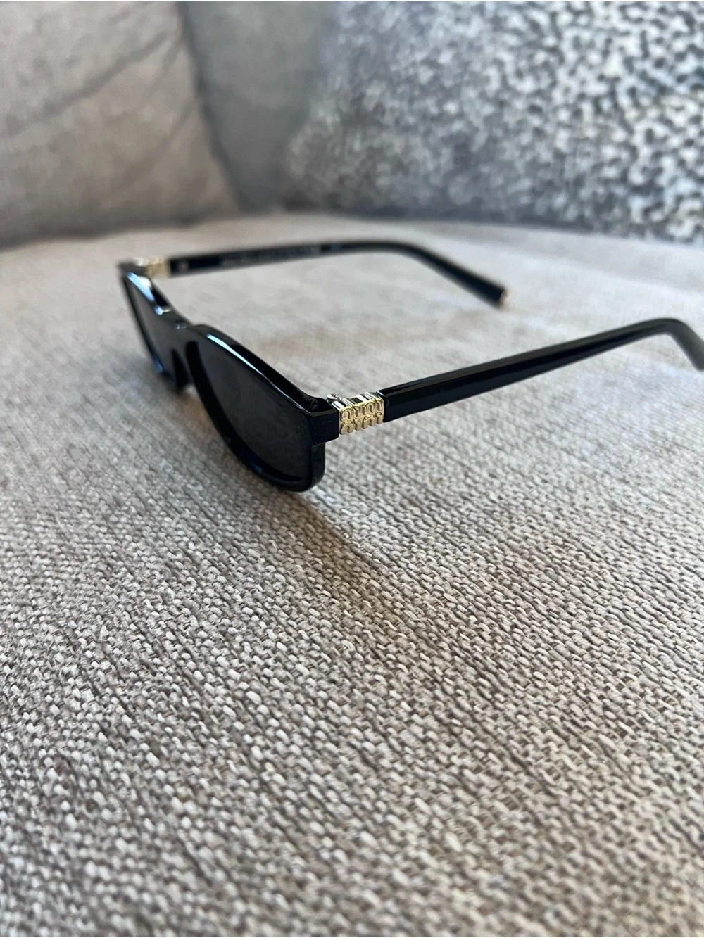 Miu Miu Black Sunglasses with Gold Accent - Classic Cat-Eye Style